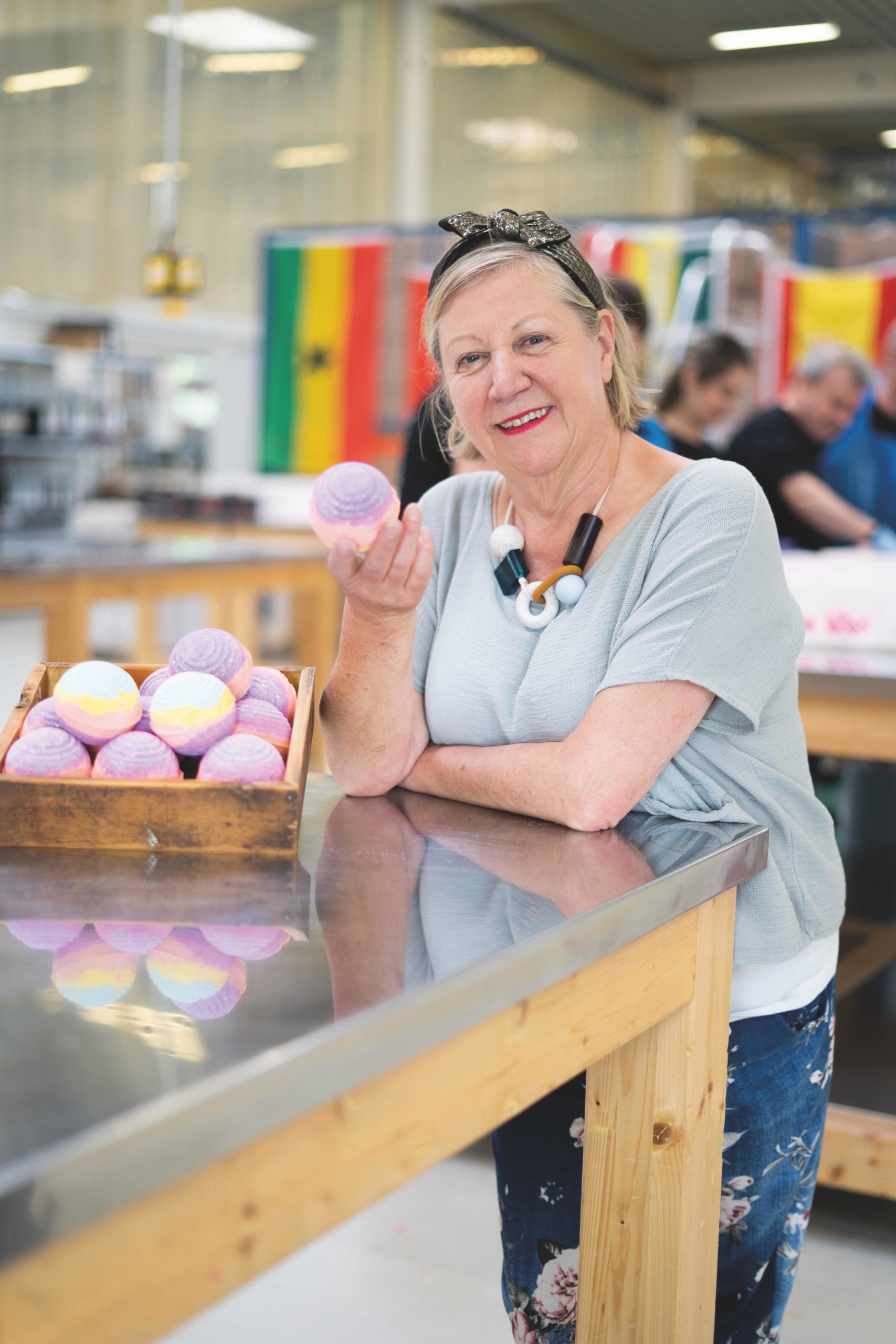 Picture of Mo Constantine holding a bath bomb